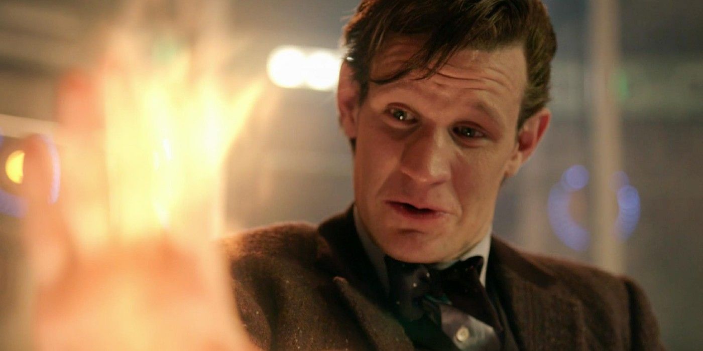 Matt Smith's Eleventh Doctor emotionally looks at his regenerating hand in Doctor Who