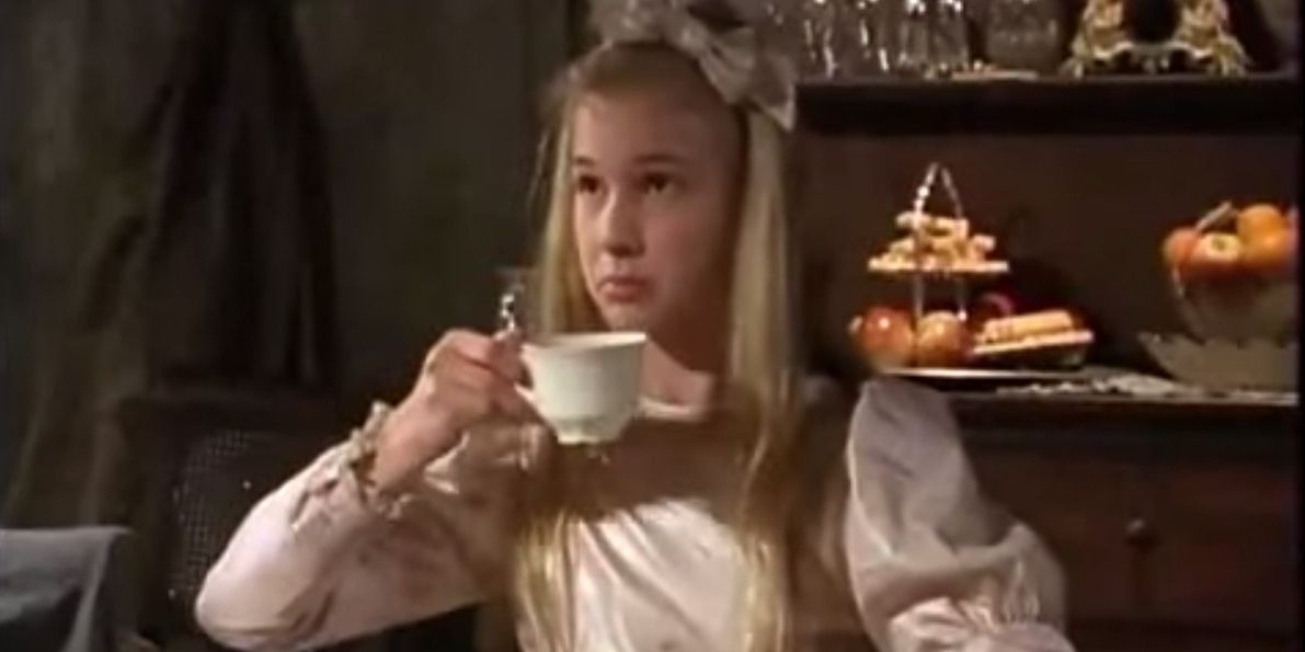 Peggy Gregory sips tea inside her mother's house