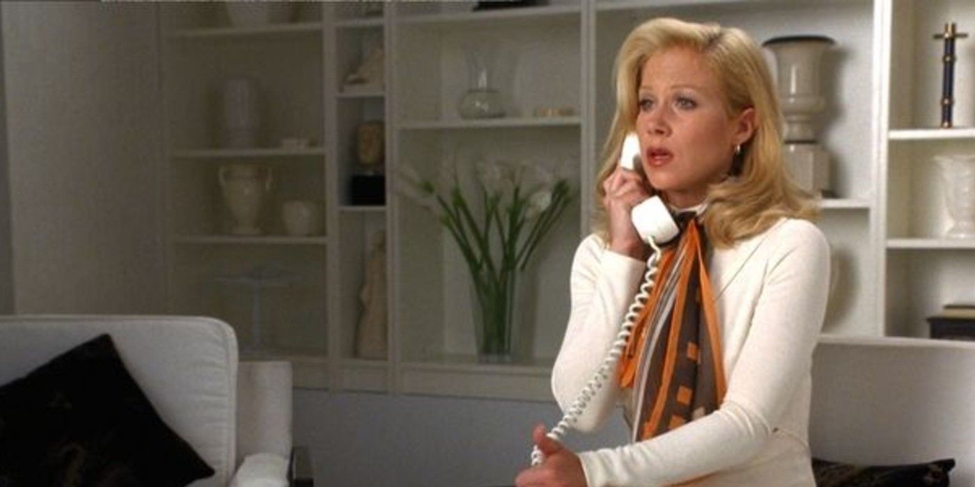Veronica Corningstonein a white dress in Anchorman on the phone