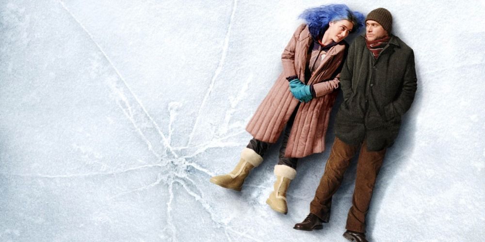 Joel and Clementine looking at each other while lying on a frozen body of water in Eternal Sunshine