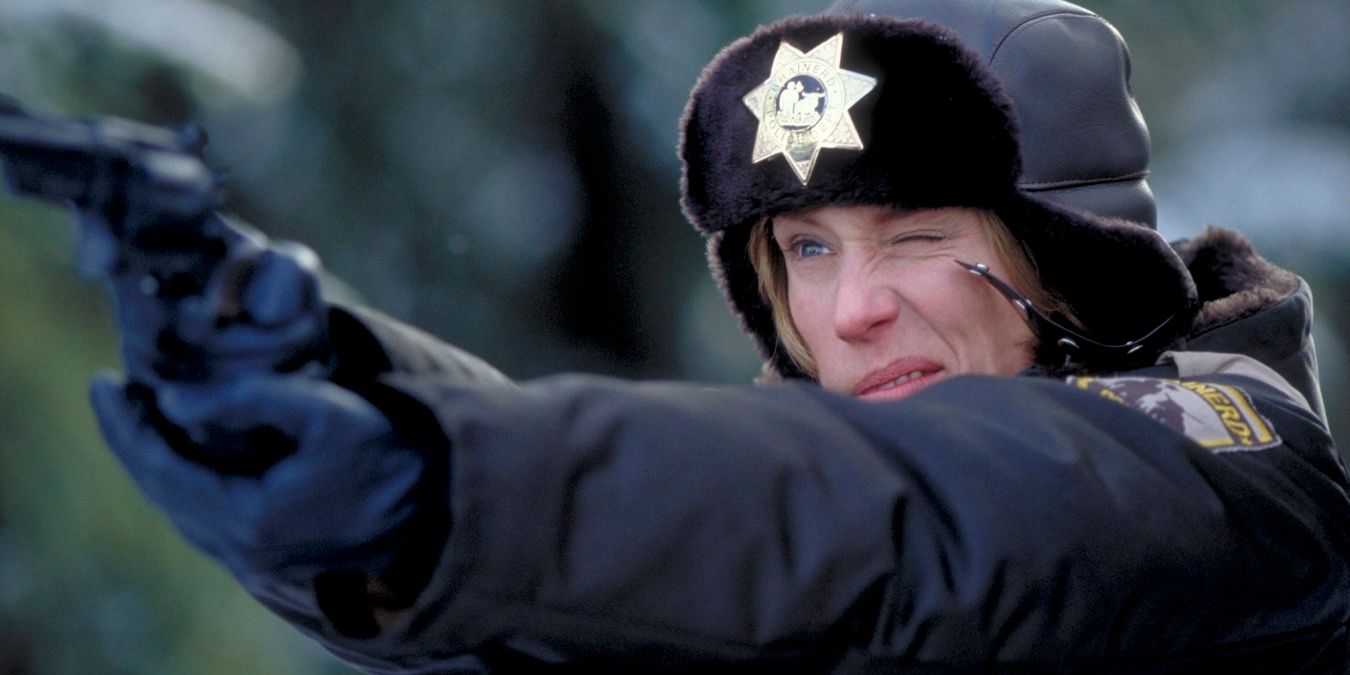 Marge Gunderson in the forest, holding out her gun in Fargo