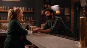 Joe Leans Across the counter of Blue Farm to talk to Georgia in Ginny and Georgia