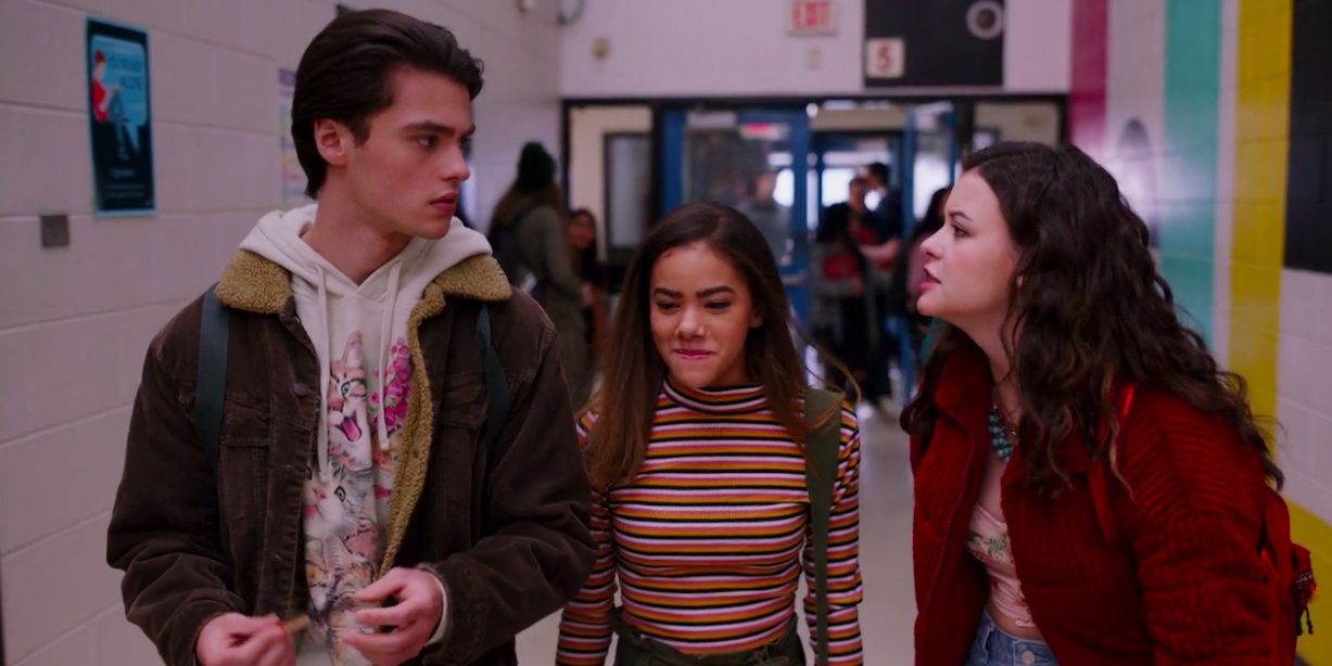 Maxine Talks Across Ginny To Marcus As They Walk Down The School Hallway in Ginny & Georgia