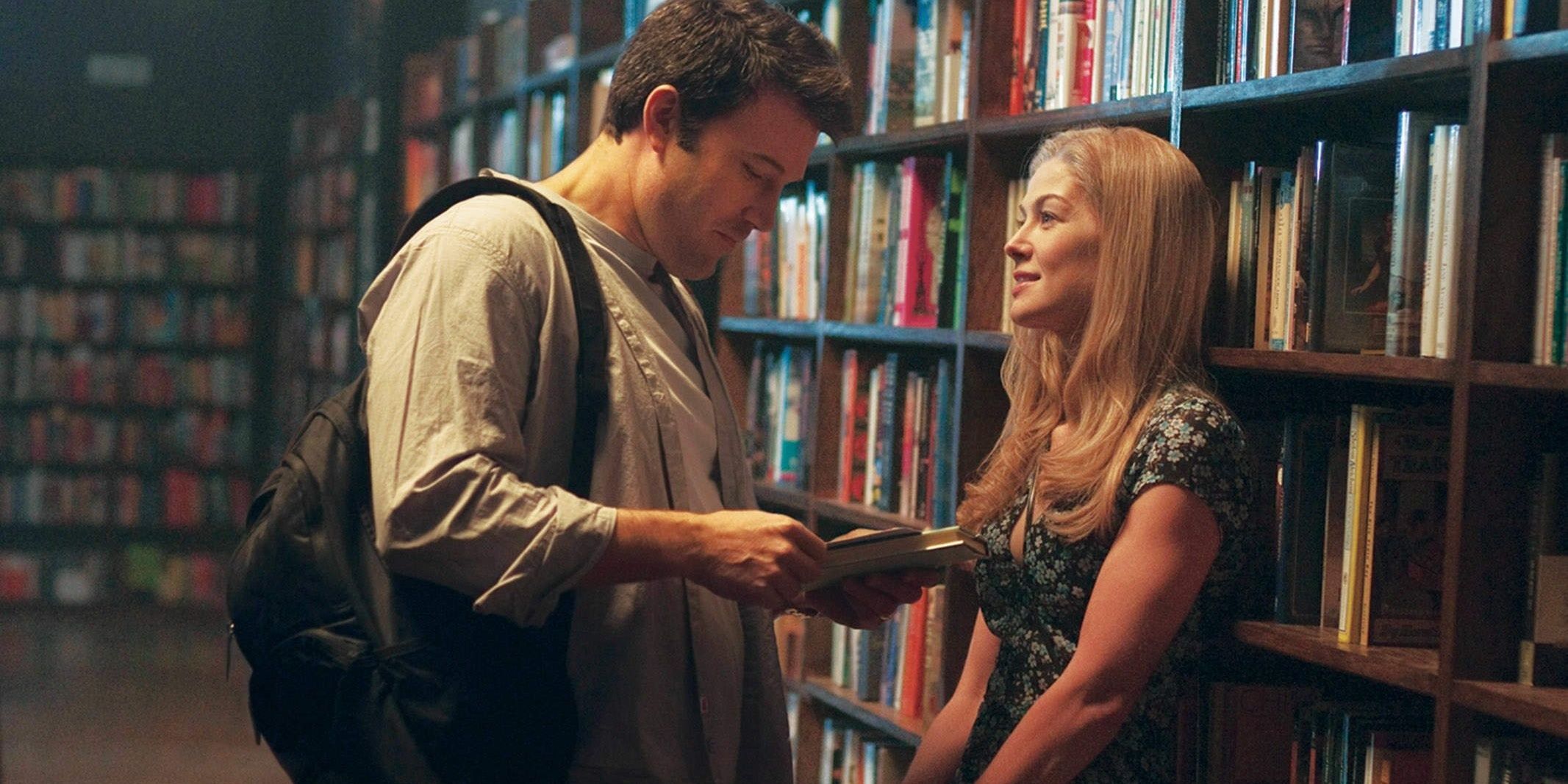 Ben Affleck talking to Rosamund Pike in a library in Gone Girl