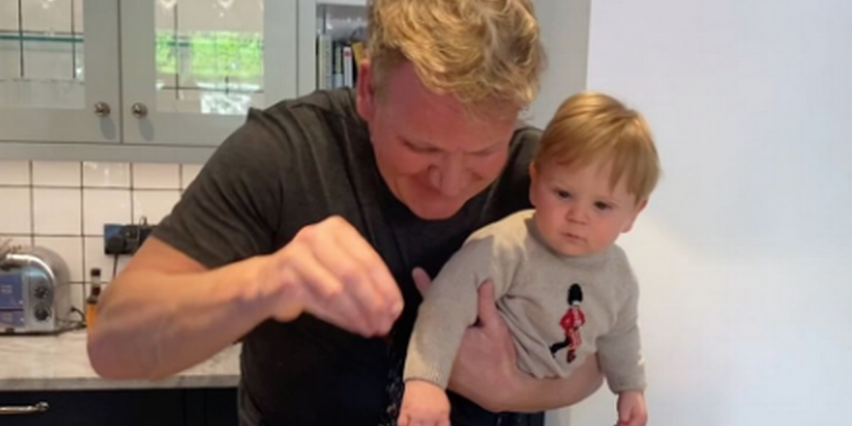 Gordon Ramsay cooking at home with his baby son.