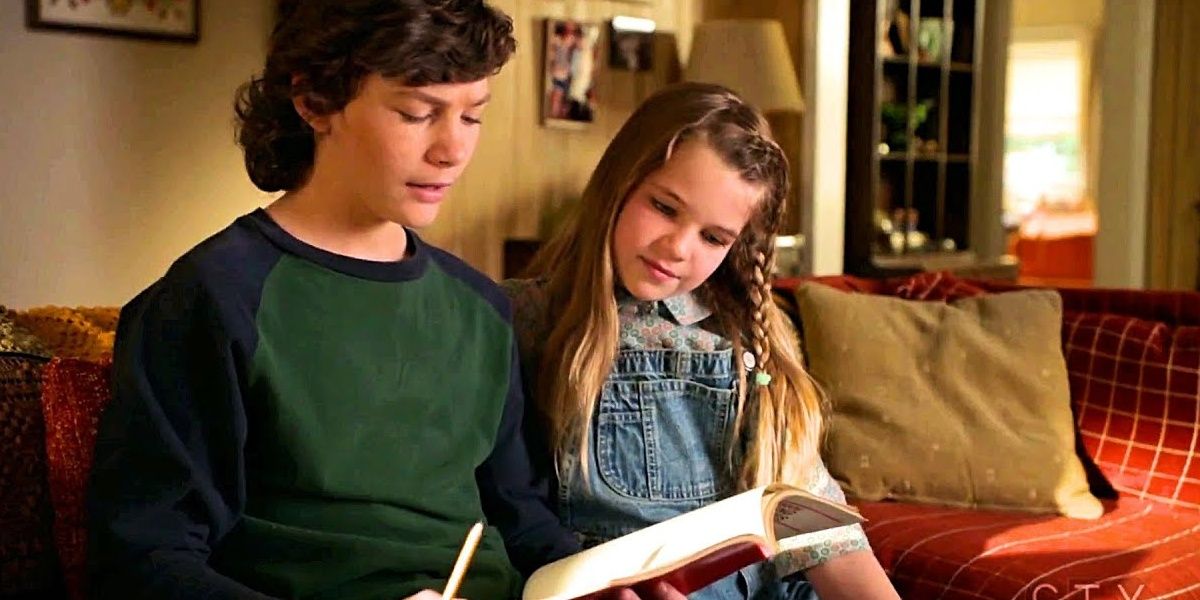 Young Sheldon: Georgie reads Missy a story in the living room