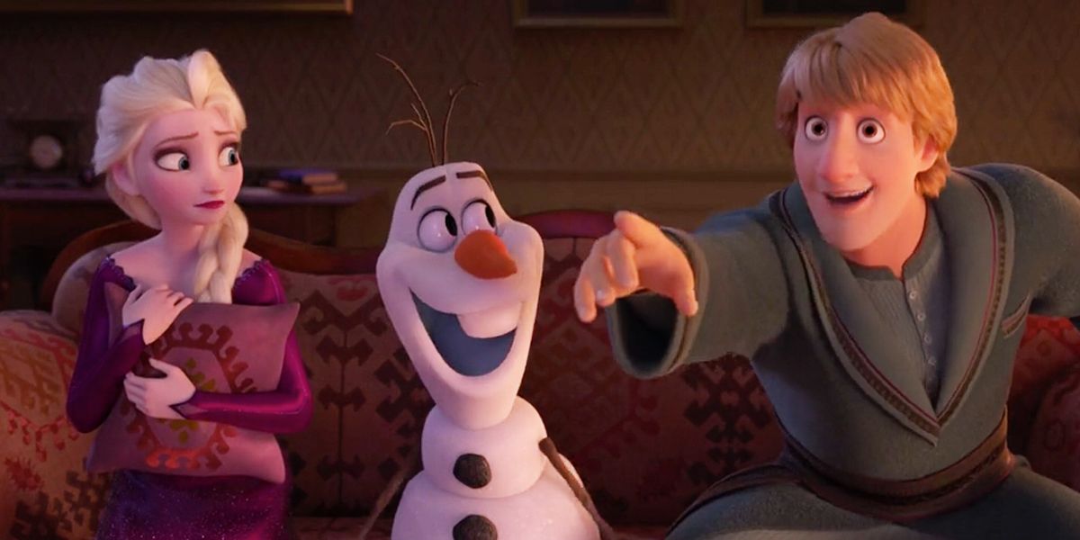 Elsa and Olaf looking Kristoff pointing as they all sit together in Frozen 2