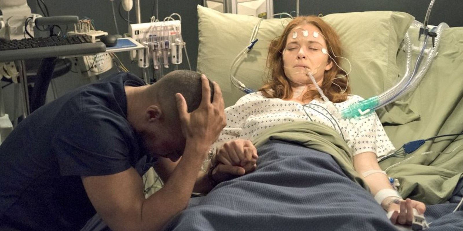 April in critical condition in a hospital bed in Grey's Anatomy.