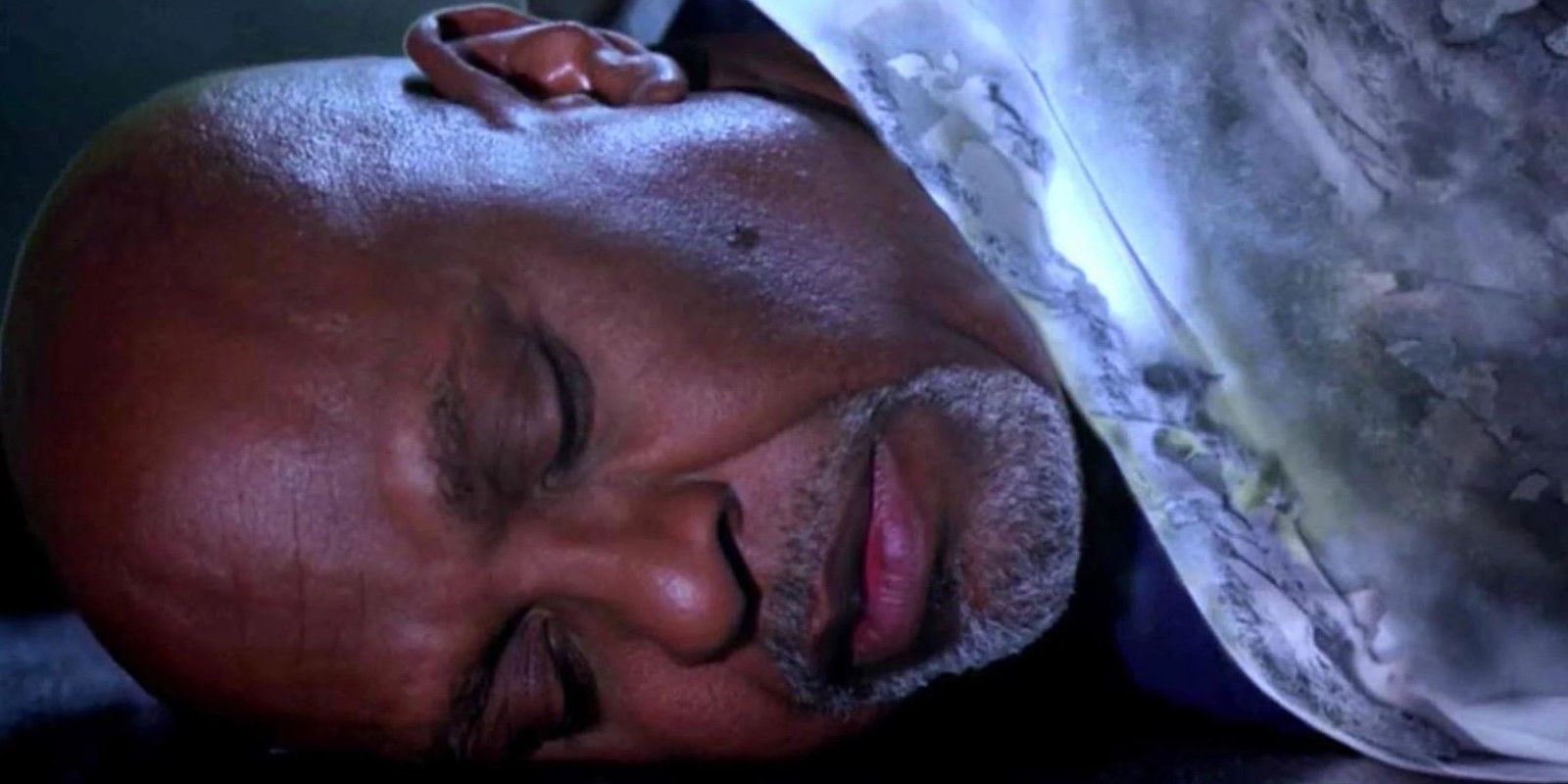 Richard lying on the ground nearly dead in Grey's Anatomy.