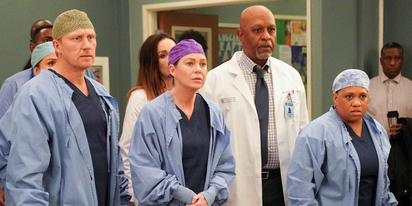 Meredith and her team looking on in Grey's Anatomy.