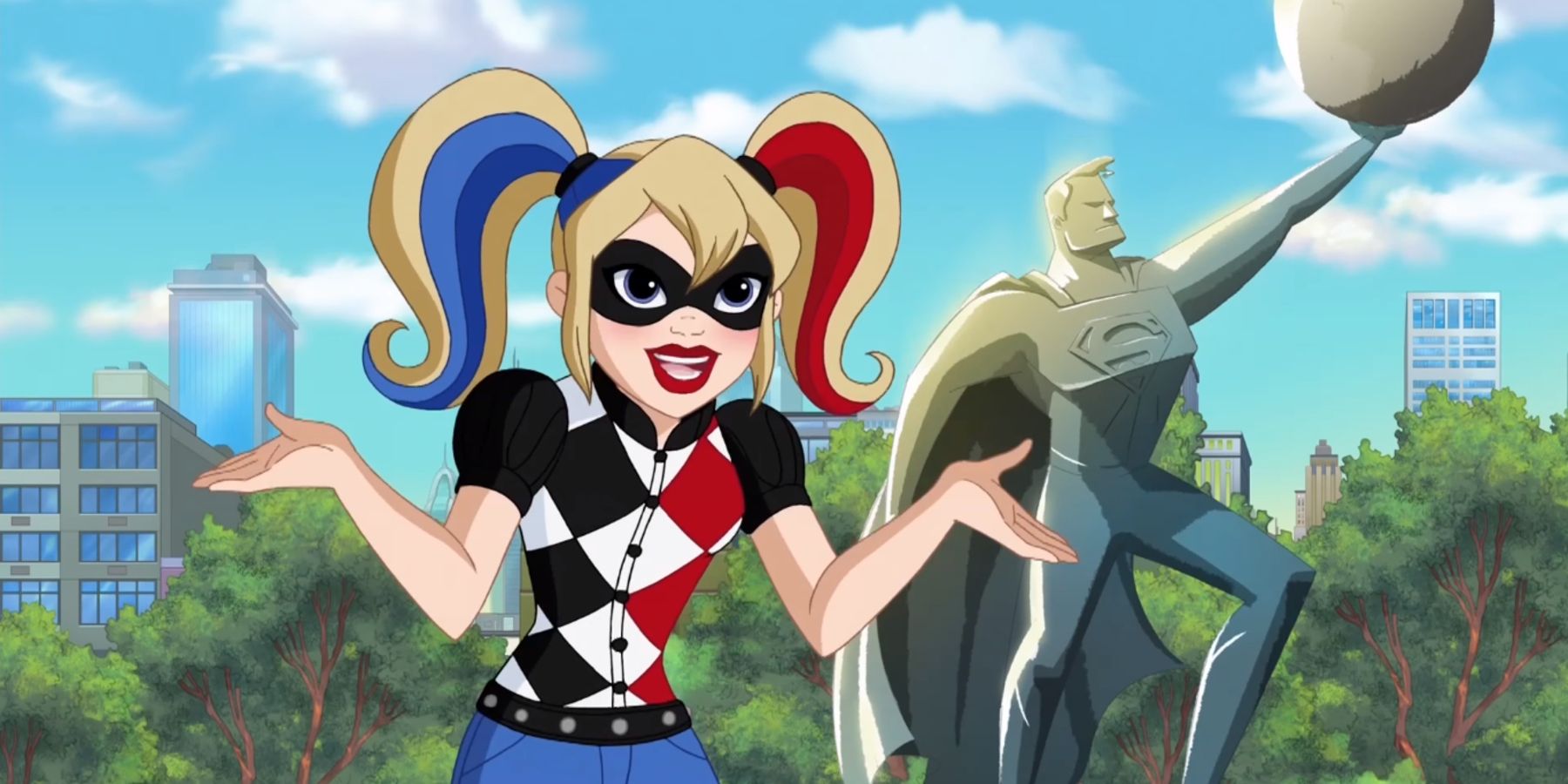 Harley Quinn In Front Of Superman Statue - DC Super Hero Girls