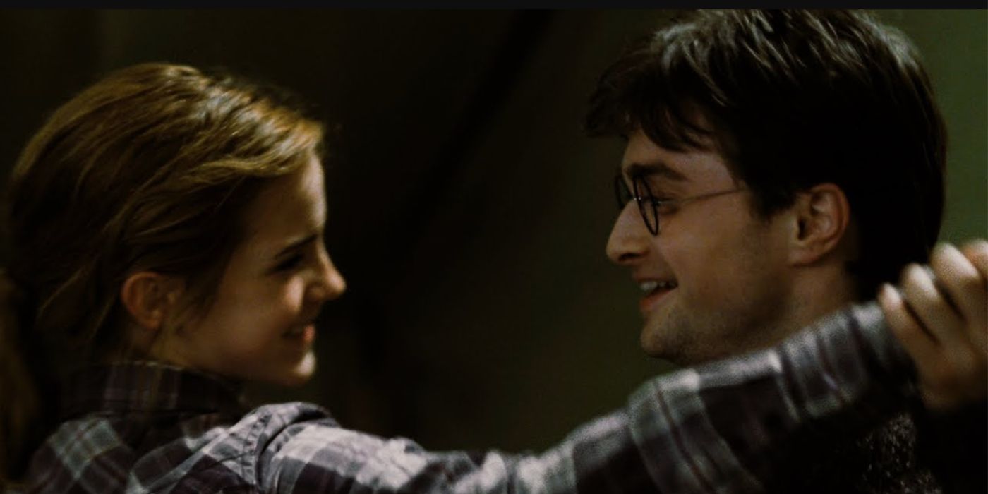 Harry and Hermione laugh as they dance together in Harry Potter