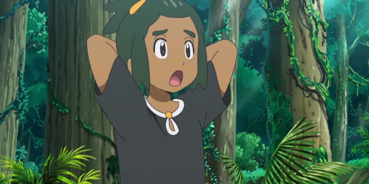 Hau standing with a puzzled expression on his face in Pokemon