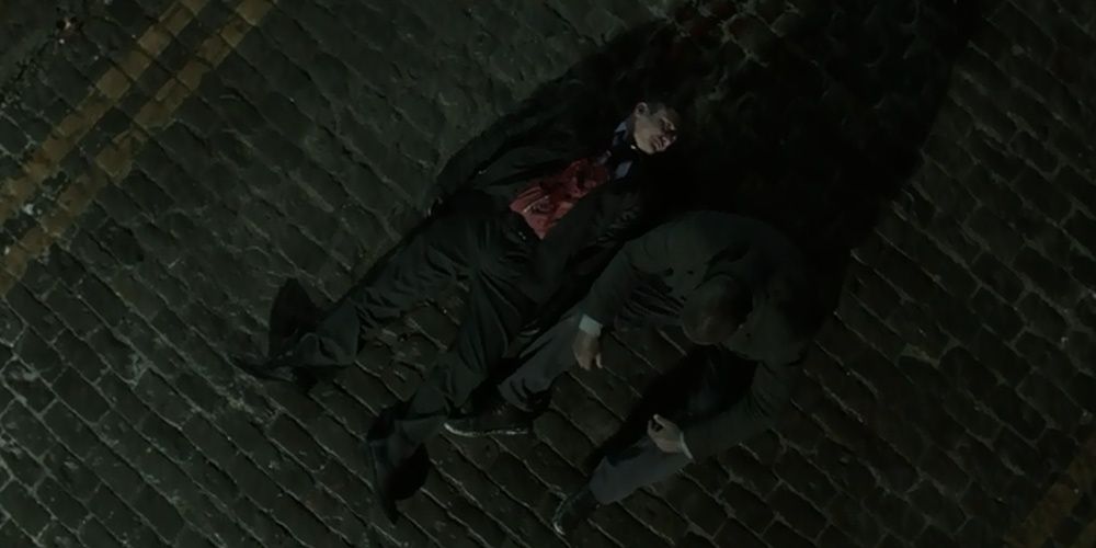 John Luther lying next to Justin Ripley's dead body