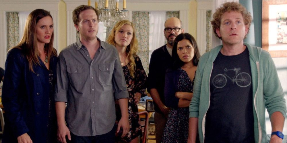 Shane, Tracy, Jenny, Pete, Glen, and Hedy standing in a dining room in It's A Disaster