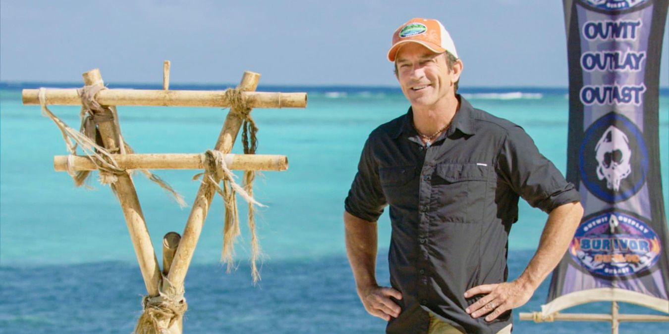 Jeff Probst at a challenge, standing in front of the water