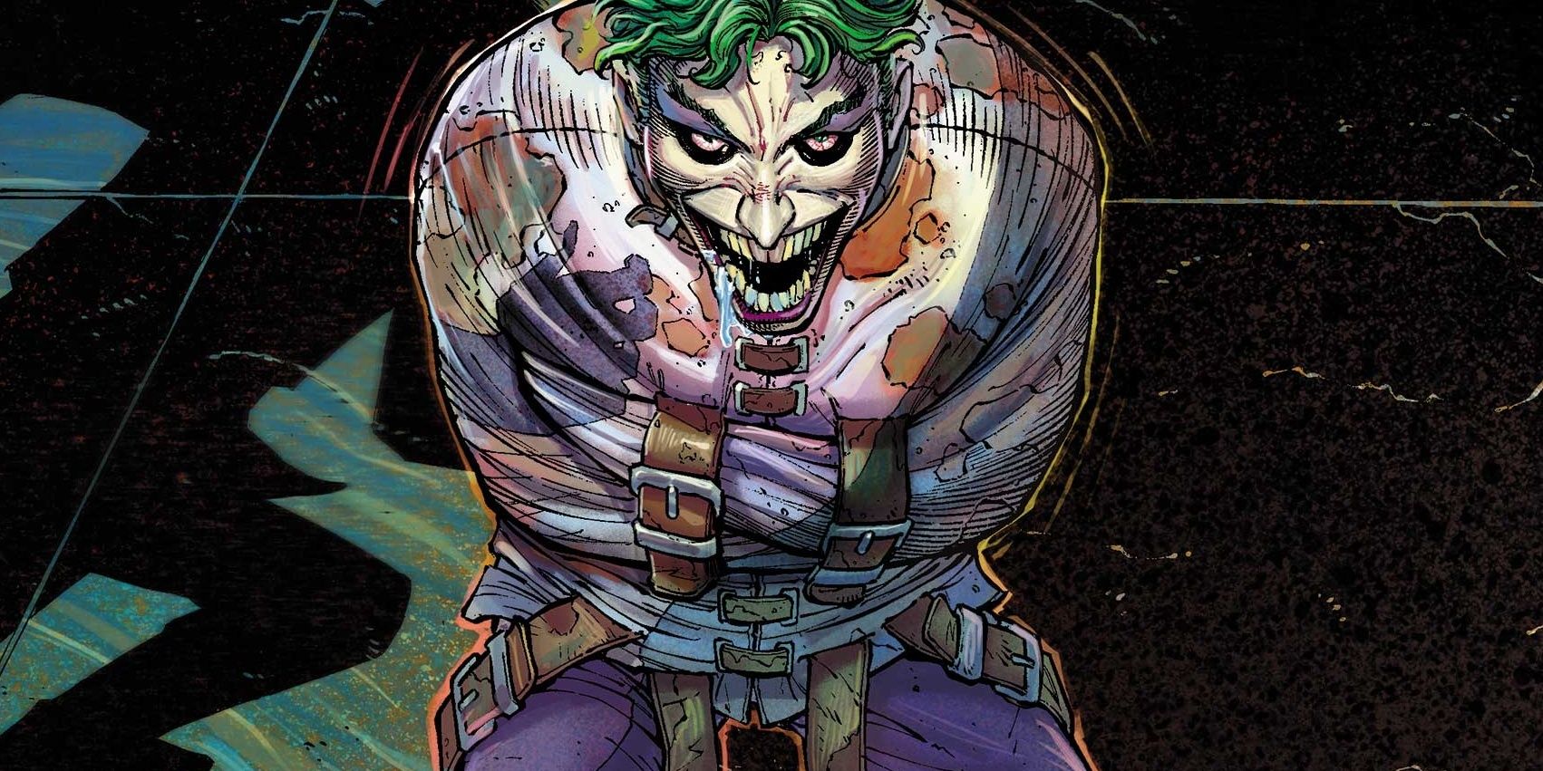Joker smiles at a security guard inside the Arkham Asylum