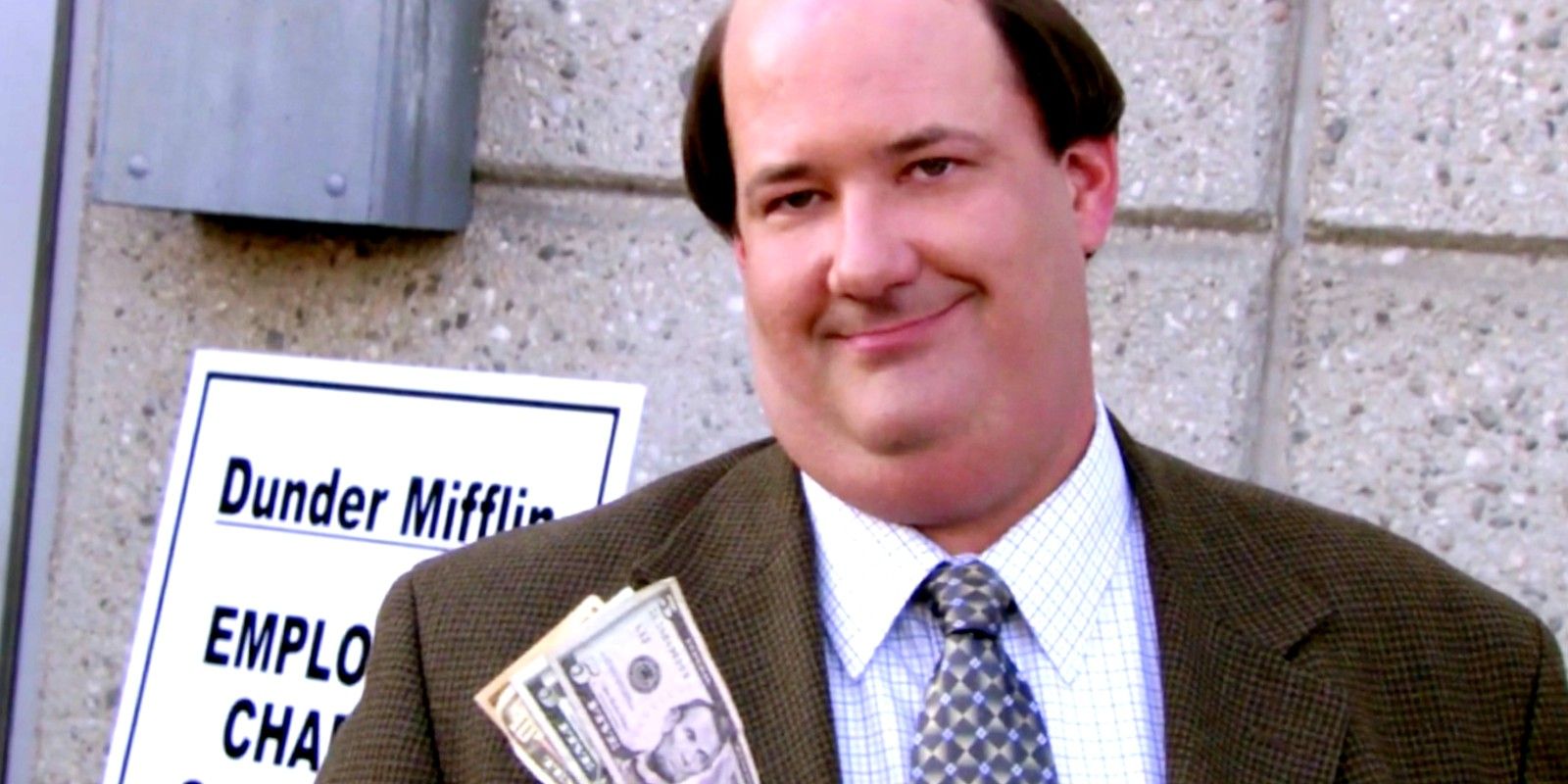 Kevin holding money in The Office