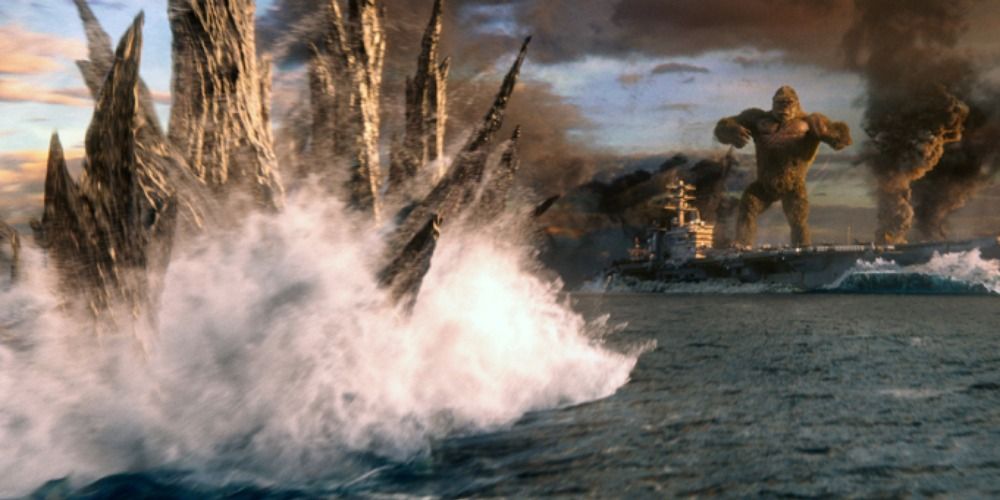 Godzilla swims towards the ship carrying Kong
