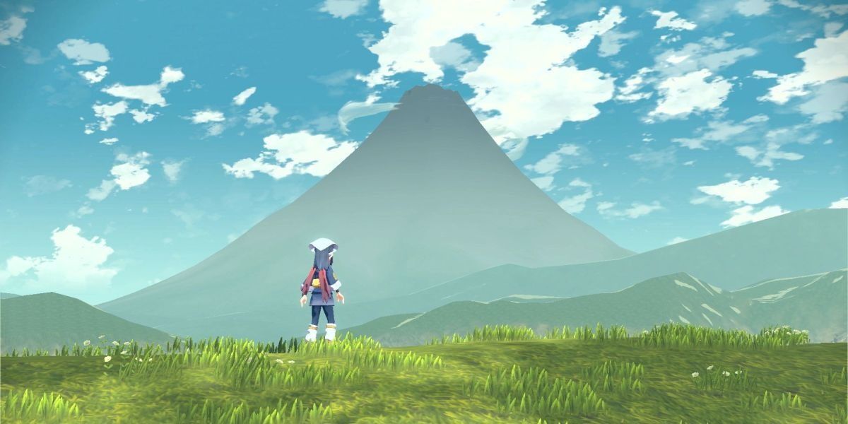 O personagem do jogador Pokémon fica no campo de frente para a montanha de costas para a câmera