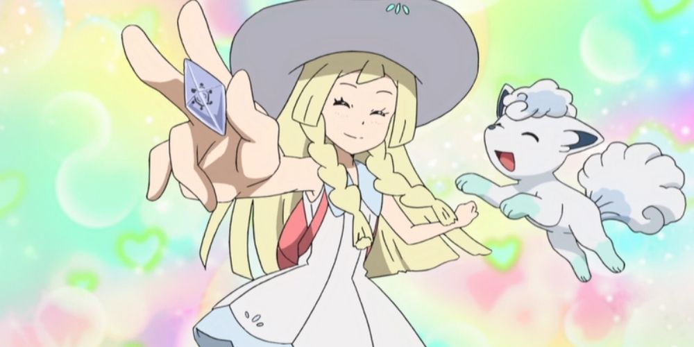 Lillie holding a Z Crystal and celebrating with Snowie in the Pokémon anime