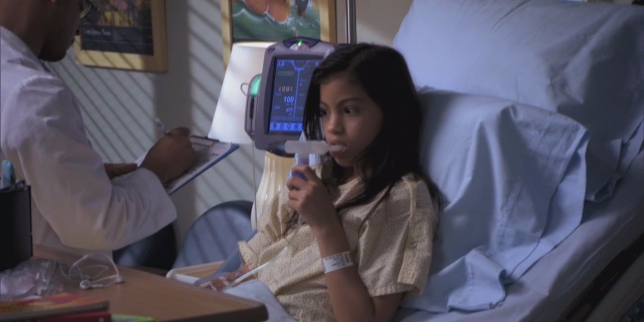 Lily breathing into a tube in Grey's Anatomy.