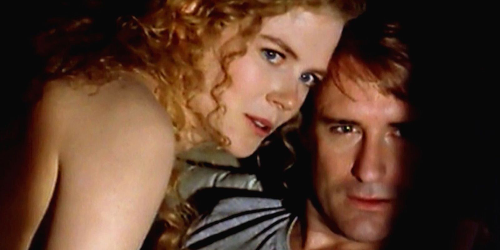 Nicole Kidman and Bill Pullman in bed looking off camera in Malice