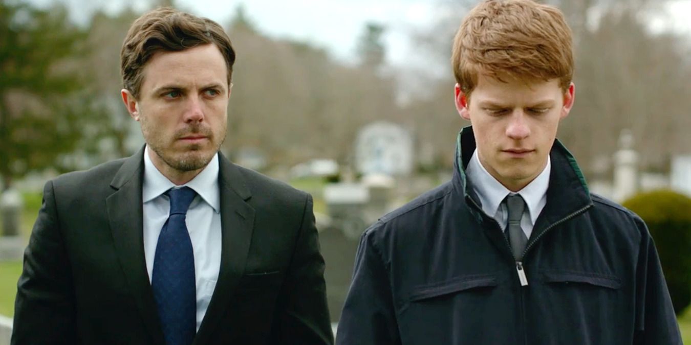 Lee and his nephew at his brother's funeral in Manchester by the Sea