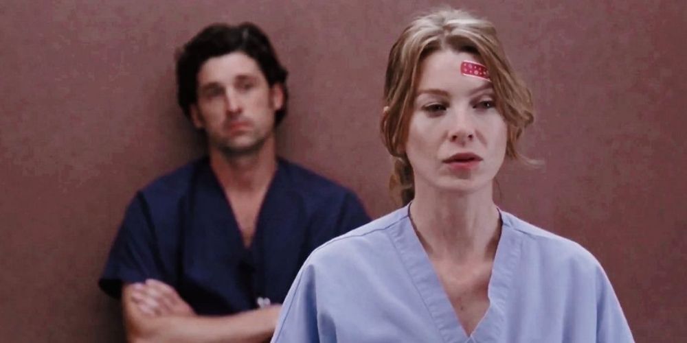 Meredith and Derek standing in the elevator in Grey's Anatomy