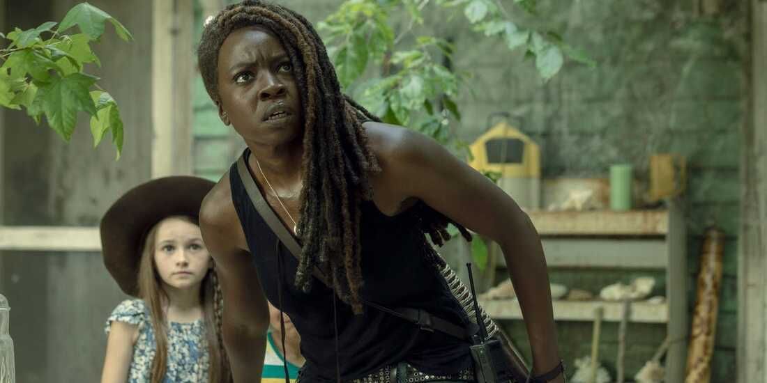 Michonne stands protectively in front of Judith in The Walking Dead
