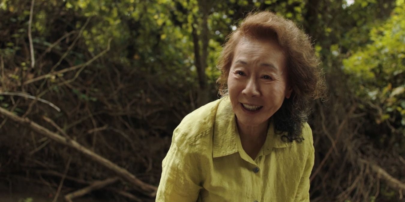 Minari Youn-Jung Youn as the grandmother, smiling by the creek