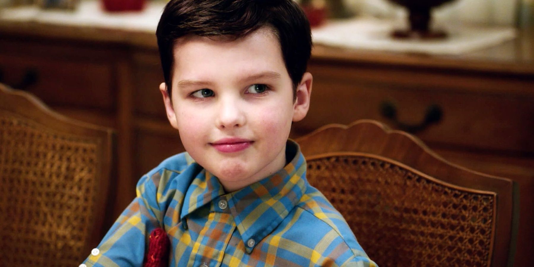 Young Sheldon Cooper close-up, slightly smiling