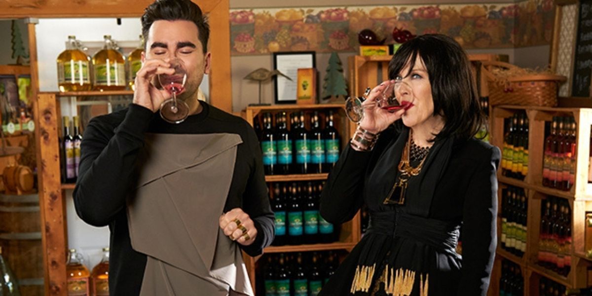 Moira and David trying out wines in Schitt's Creek