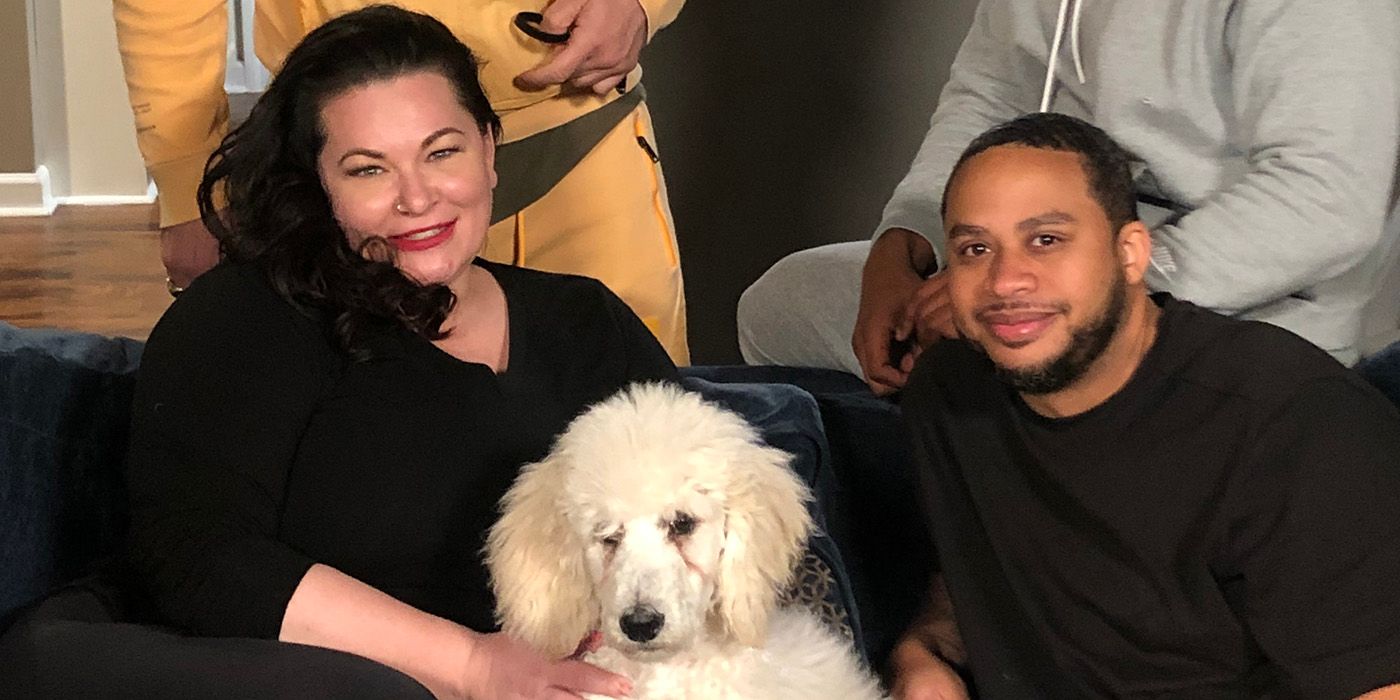 Molly Hopkins from 90 Day Fiancé petting a white dog