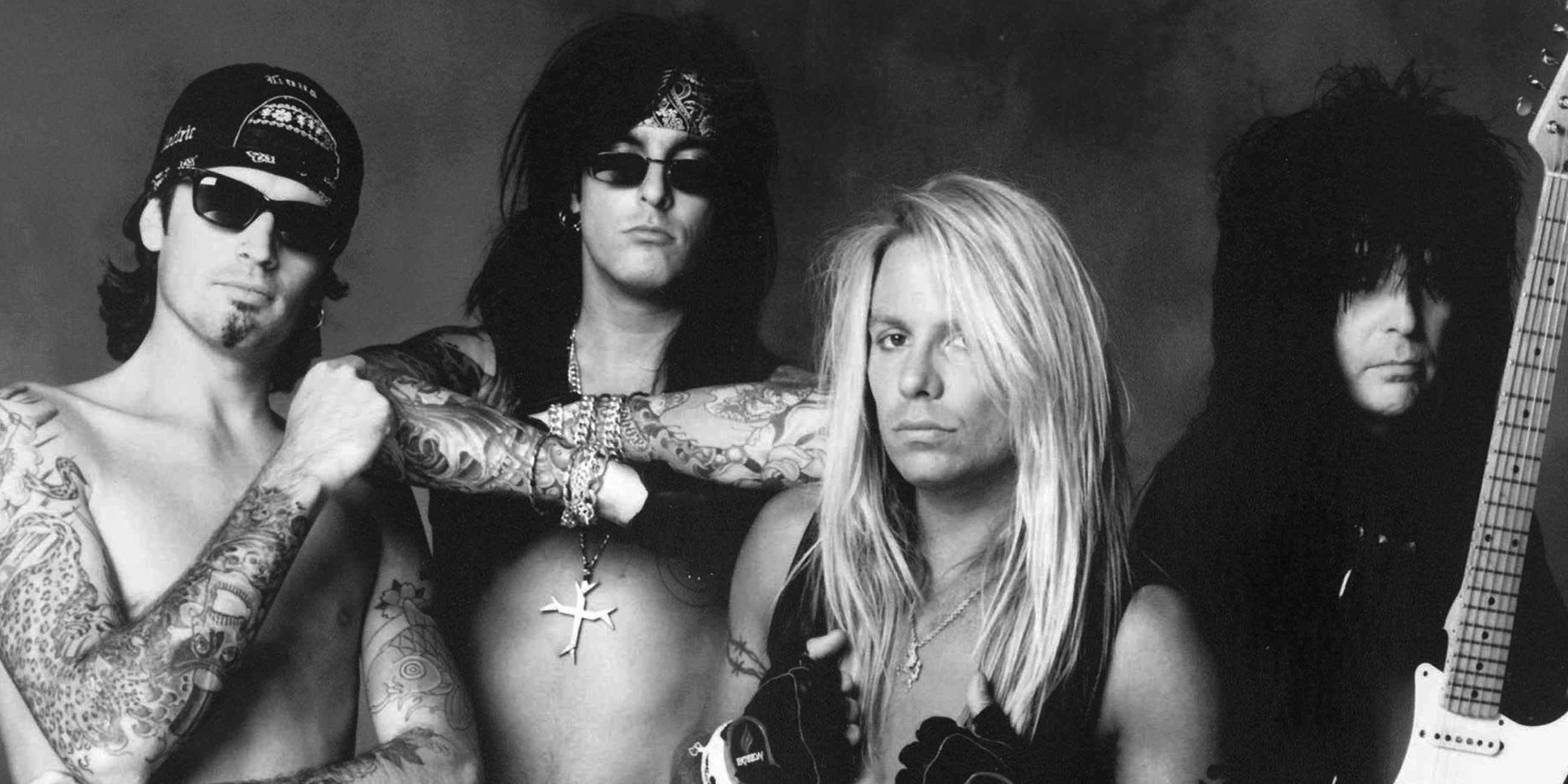 The band Motley Crue posing in a black and white photo