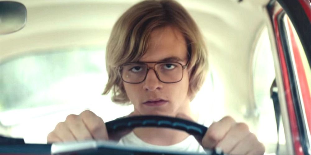 Jeff Dahmer staring into space as he drives in a scene from My Friend Dahmer