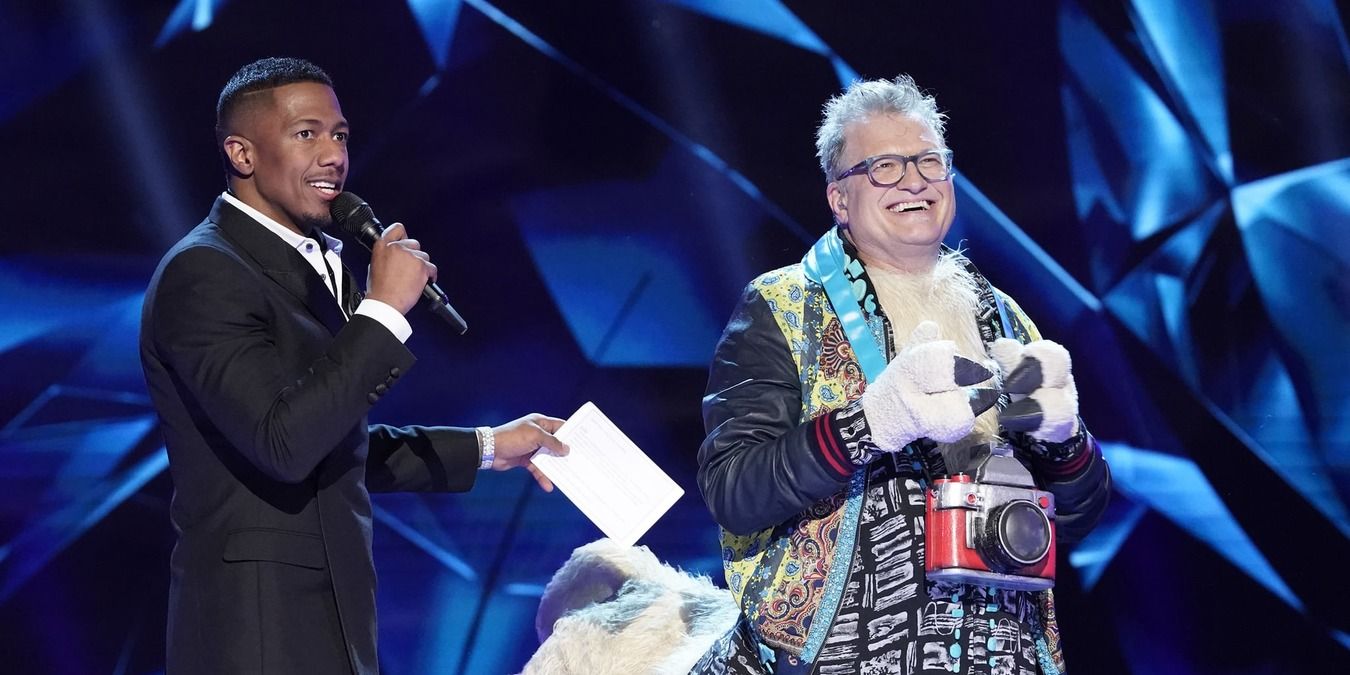 Nick Cannon revealing Drew Carey as Llama on The Masked Singer