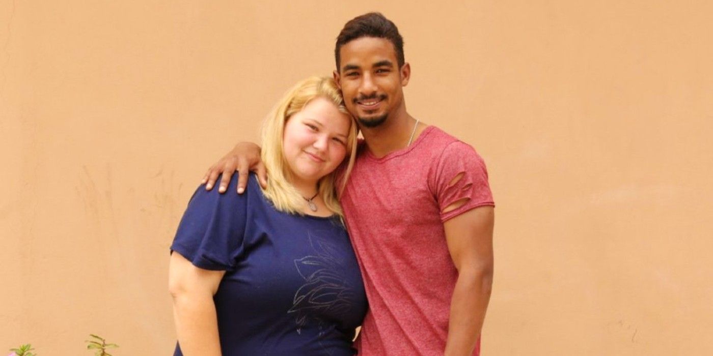 Nicole and Azan 90 Day Fiancé posing together in front of light orange background