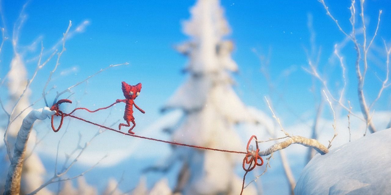 Yarny uses thread to walk from one branch to another in Unravel on the Nintendo Switch.