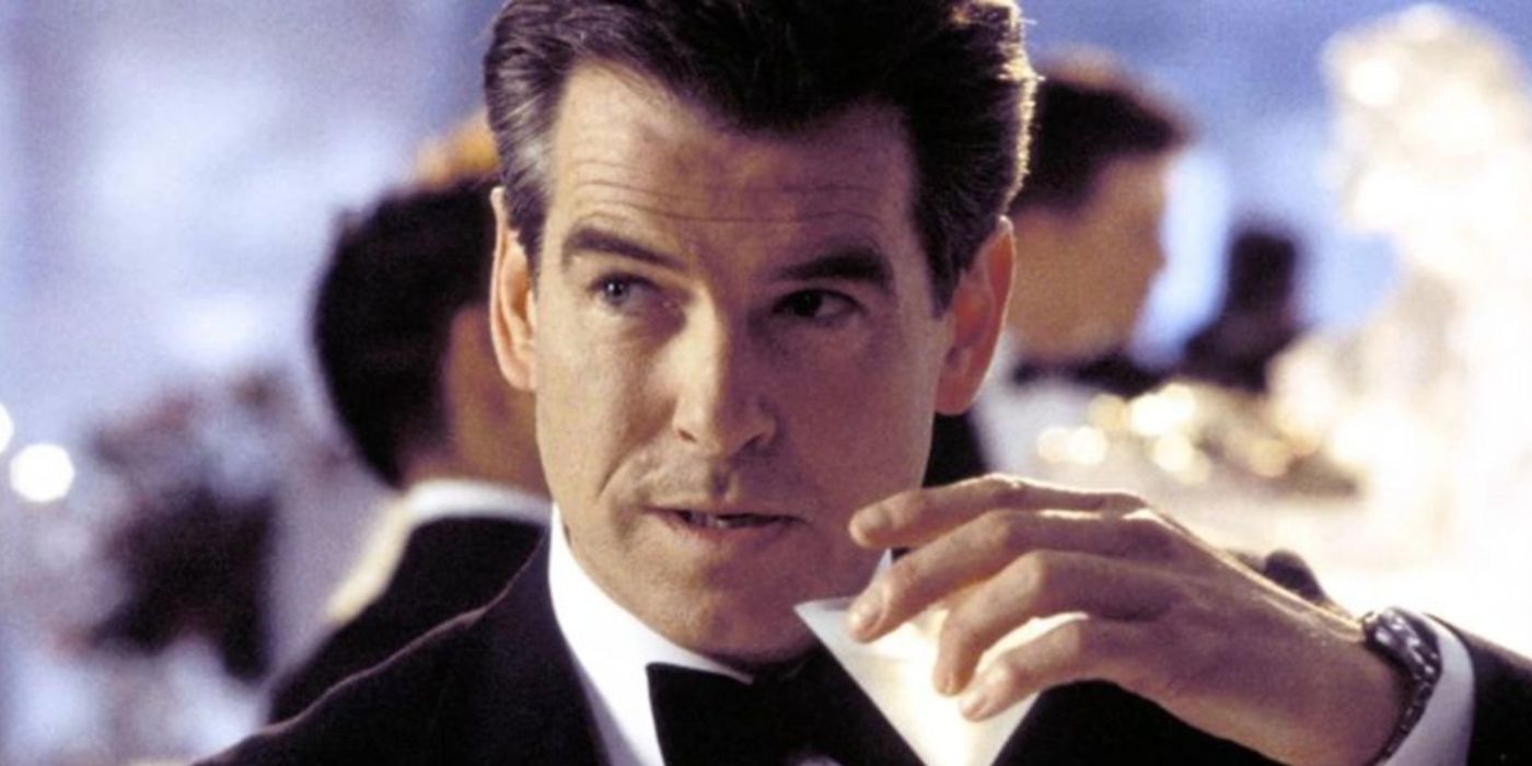 Pierce Brosnan as 007 having a drink as he looks sideways