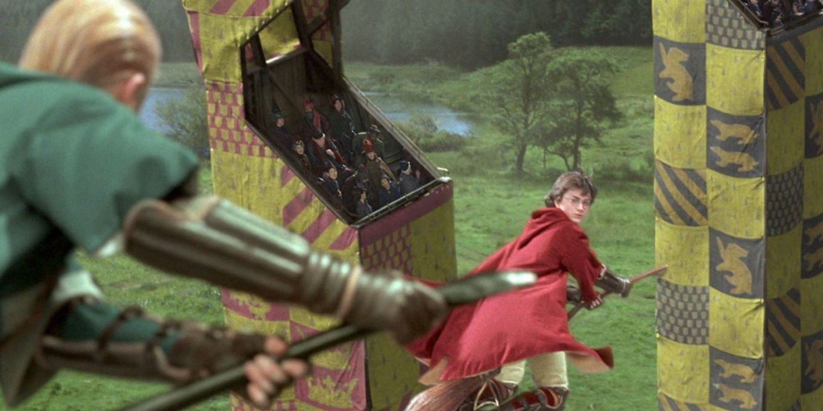 Malfoy approaches Harry on a broom during Quidditch