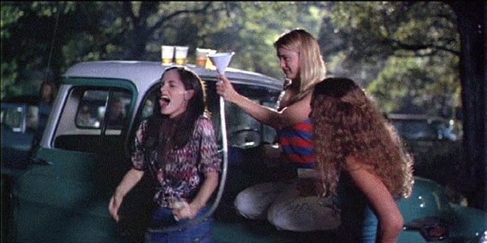 Renee Zellweger and two other girls playing around in Dazed and Confused