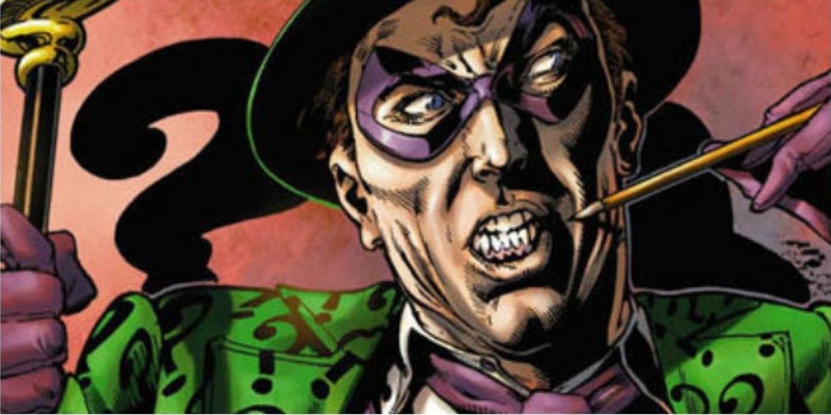 The Riddler chews on a pencil while pondering a riddle