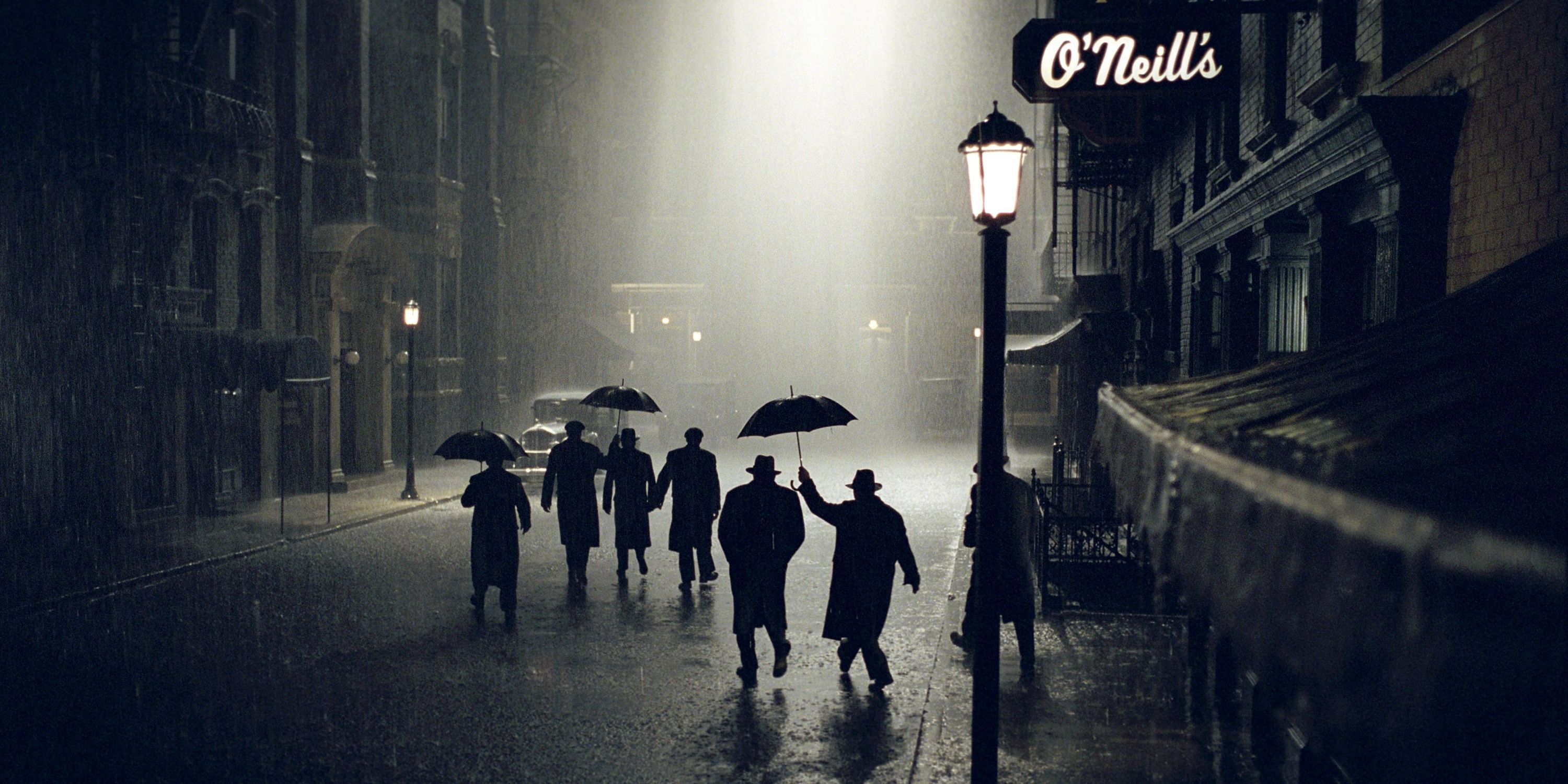 A group of men exit a bar and in to the pouring rain in Road to Perdition