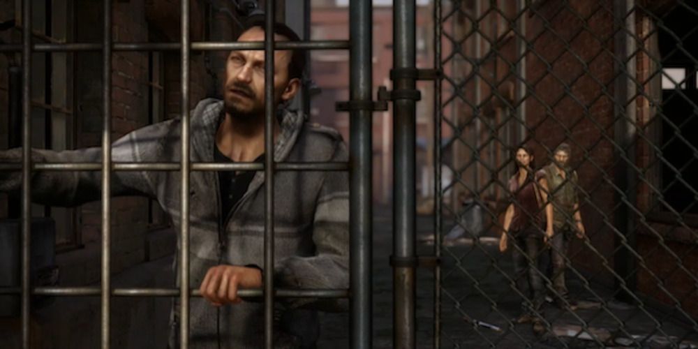 Robert is trapped behind bars with Tess and Joel standing behind 