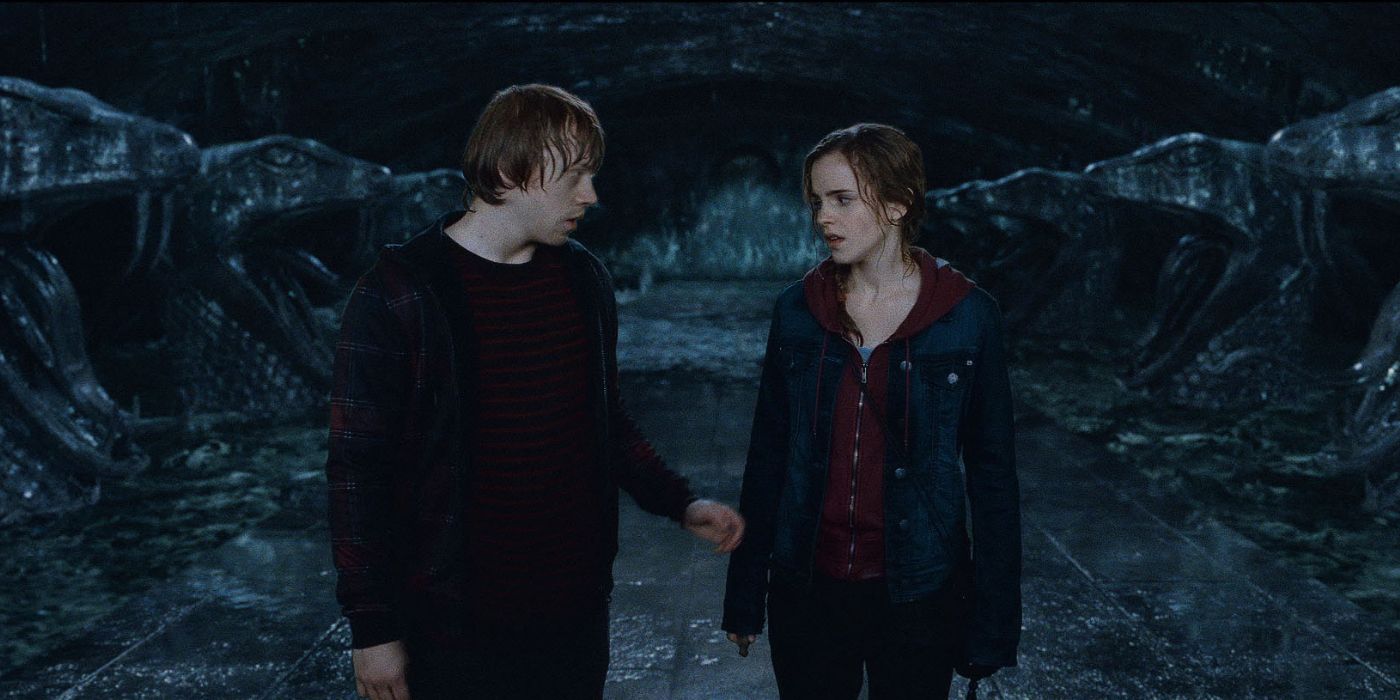 Ron holds Hermione's hand in the Chamber of Secrets in Harry Potter and the Deathly Hallows Part 2