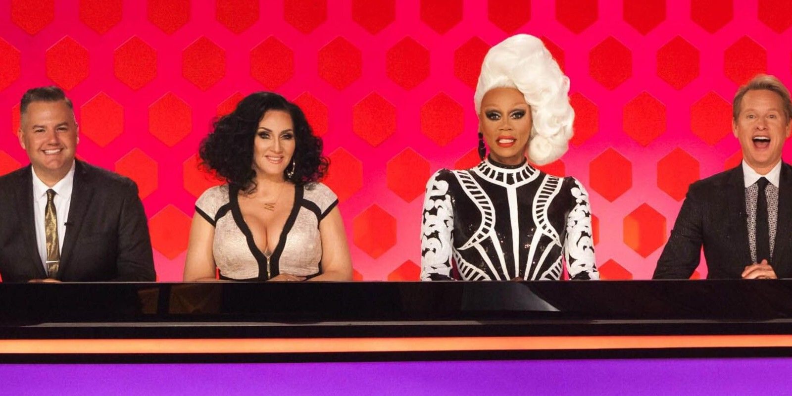 The judges sitting on the judges' panel in RuPaul's Drag Race.