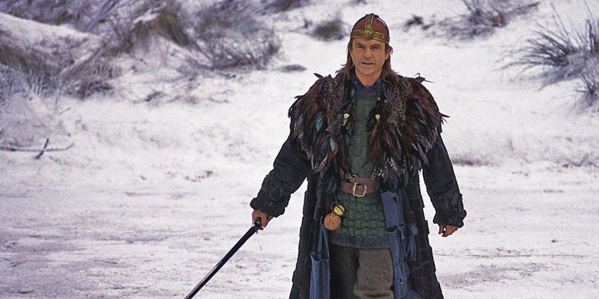 Merlin wielding sword in snowy mountain in Merlin