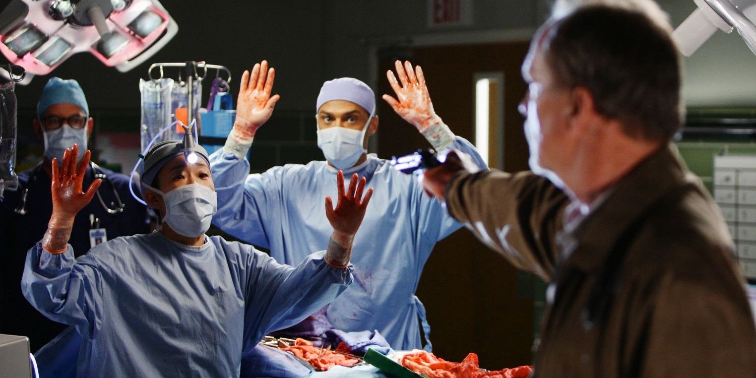 Gary Clark points a gun at surgeons in the operating room in Grey's Anatomy
