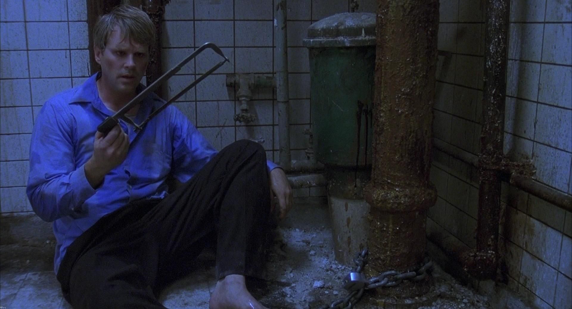 A man chained to a pipe in the original Saw movie.